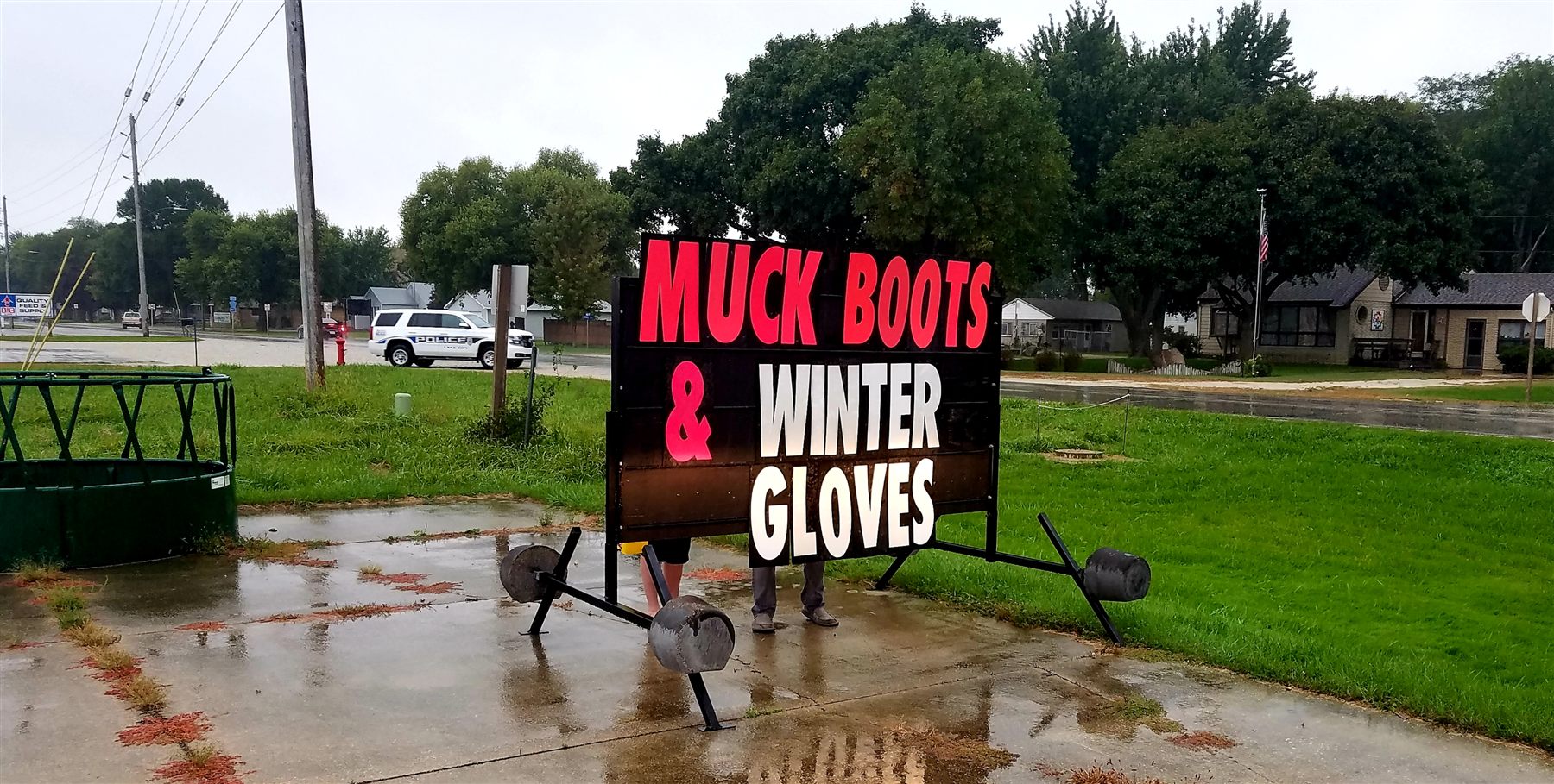 Muck boots and winter gloves sign