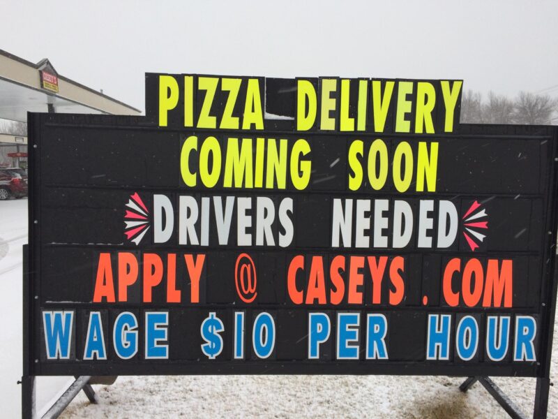 Pizza delivery and driver hiring sign